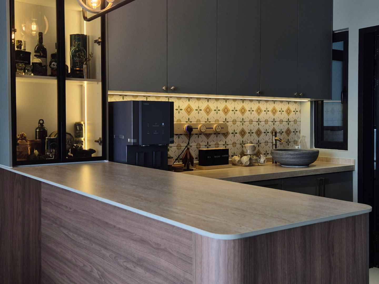 Wood-finish kitchen bar counter with glass display cabinet and built-in water dispenser